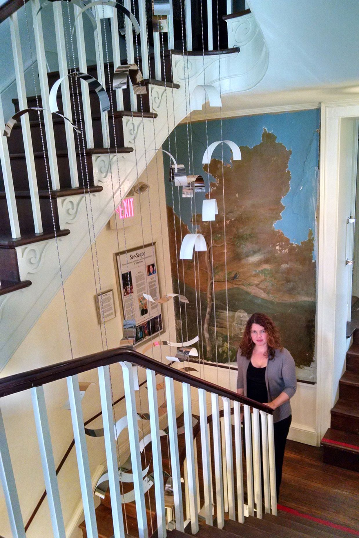 Artist Talley Fisher with her suspended sculpture, See-Scape, Bellefonte Art Museum