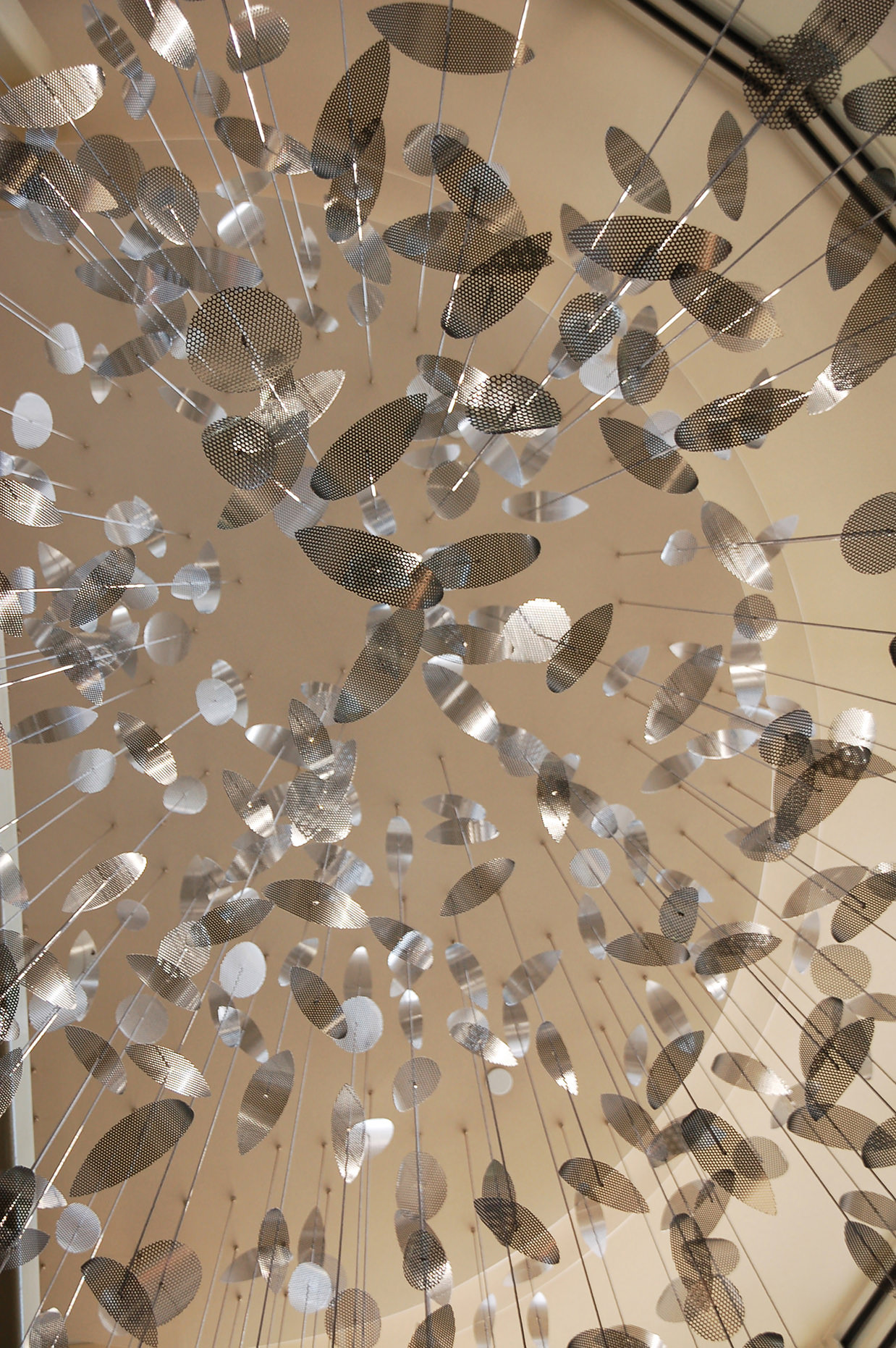 Silver curves come together to form Constellation II by Talley Fisher, inspired by hanging mobile art.