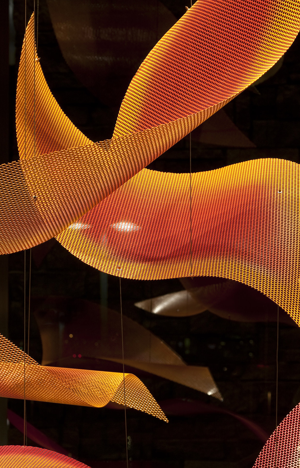 Vibrant orange and yellow petals from Sunrise Cascade, contemporary sculpture by Talley Fisher