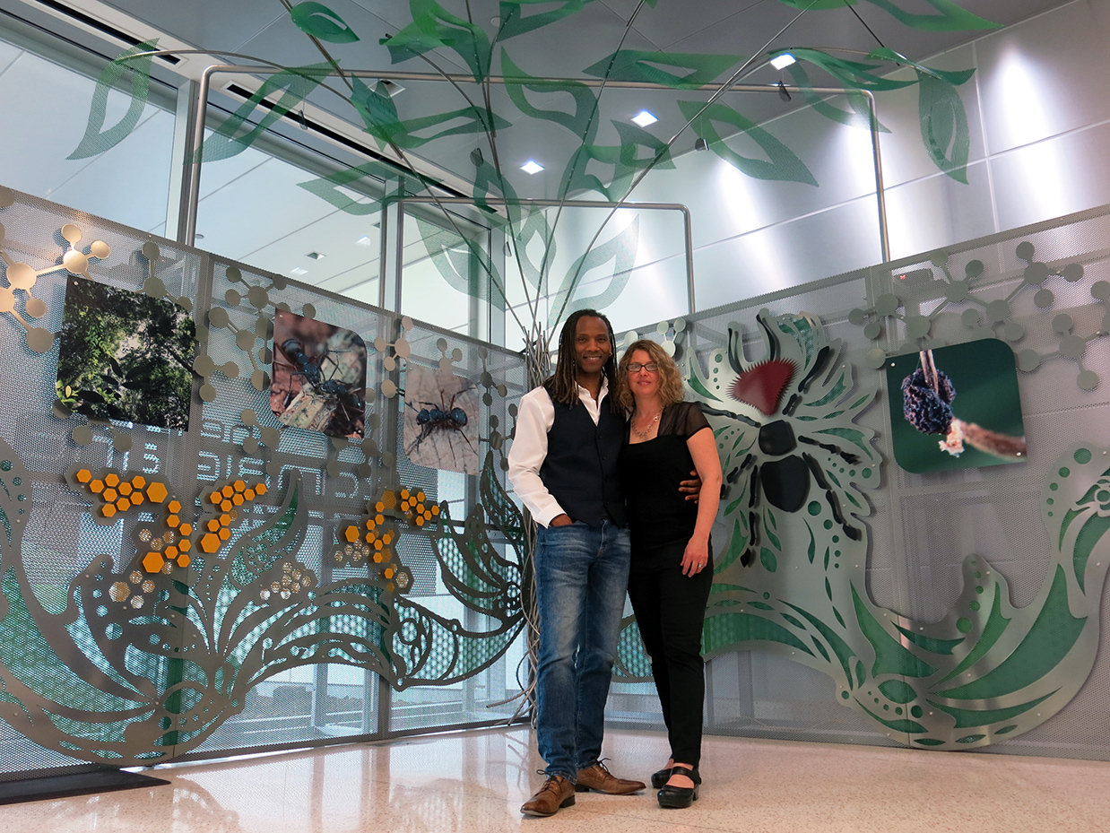 Lead Daryl Branford and Talley Fisher in front of The Zombie Ant Experience interactive sculpture at Penn State Huck Institute of Life Sciences