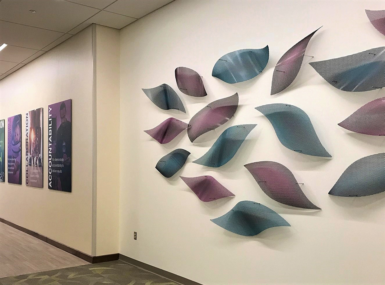 Petals dance along the hospital corridor in this wall mounted sculpture.