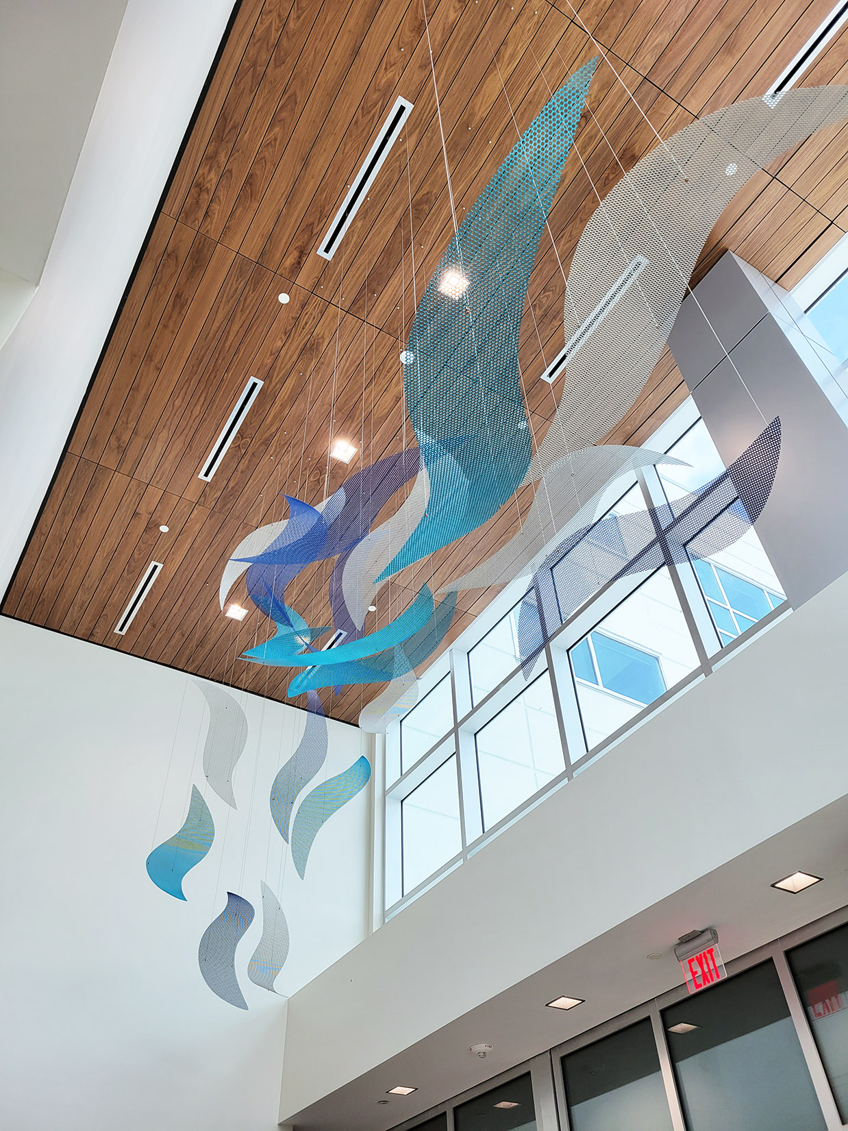 Blue and silver waves of Tranquil Tides in the lobby of Mease Countryside Hospital