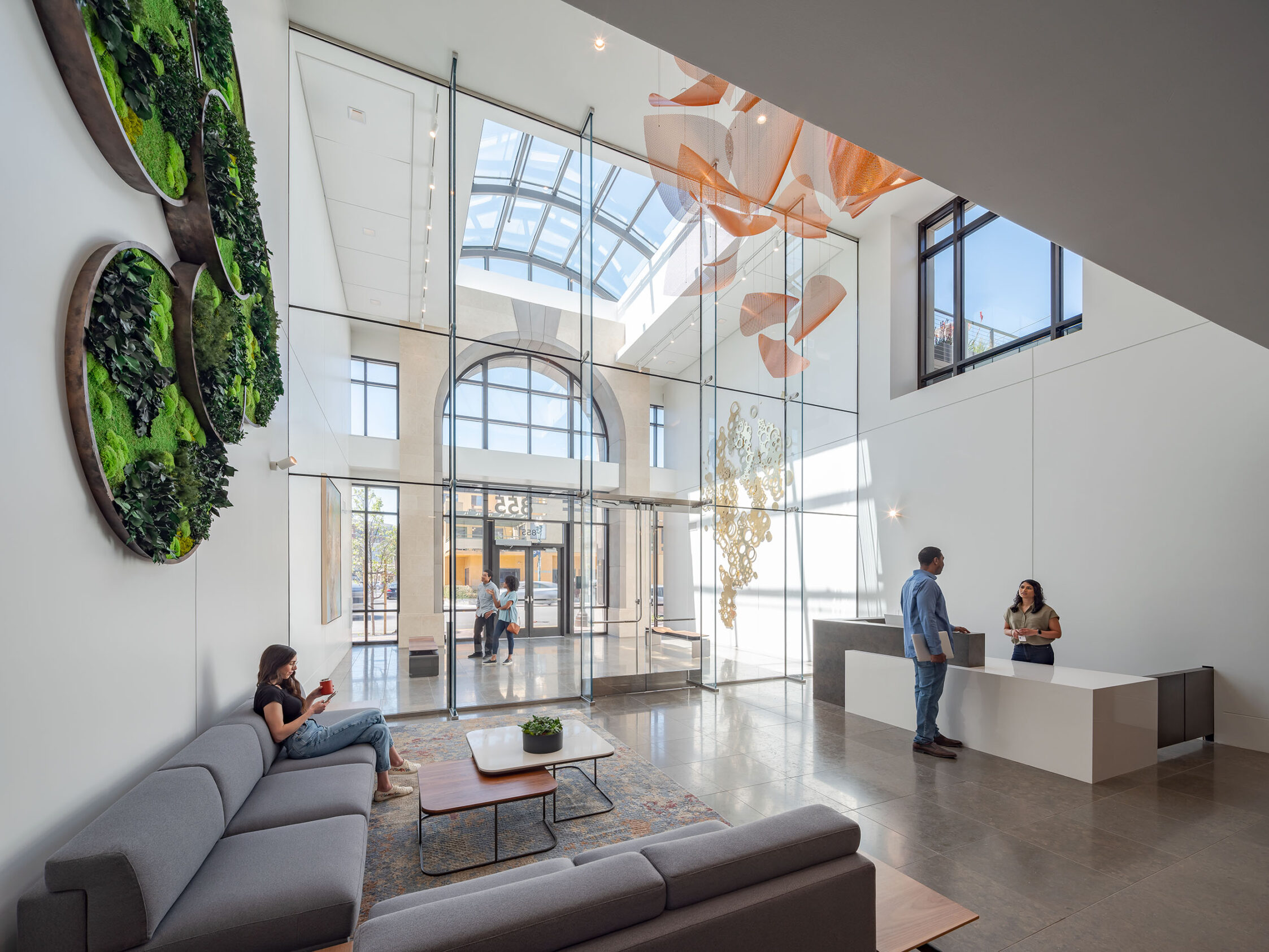 The lobby sculpture of 855 Main is seen suspended alongside other artworks to make a gallery space.