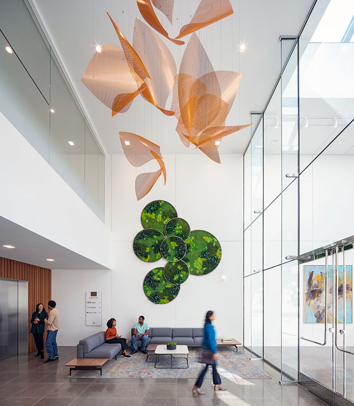 Abstract copper petals hang in clusters in the lobby of 855 Main.